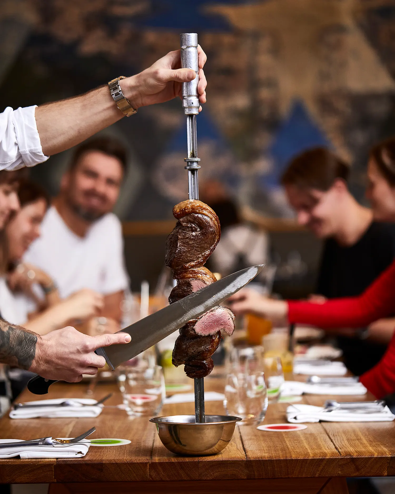 Churrasco at Brasileiro restaurant – beef served on a skewer directly at the table.