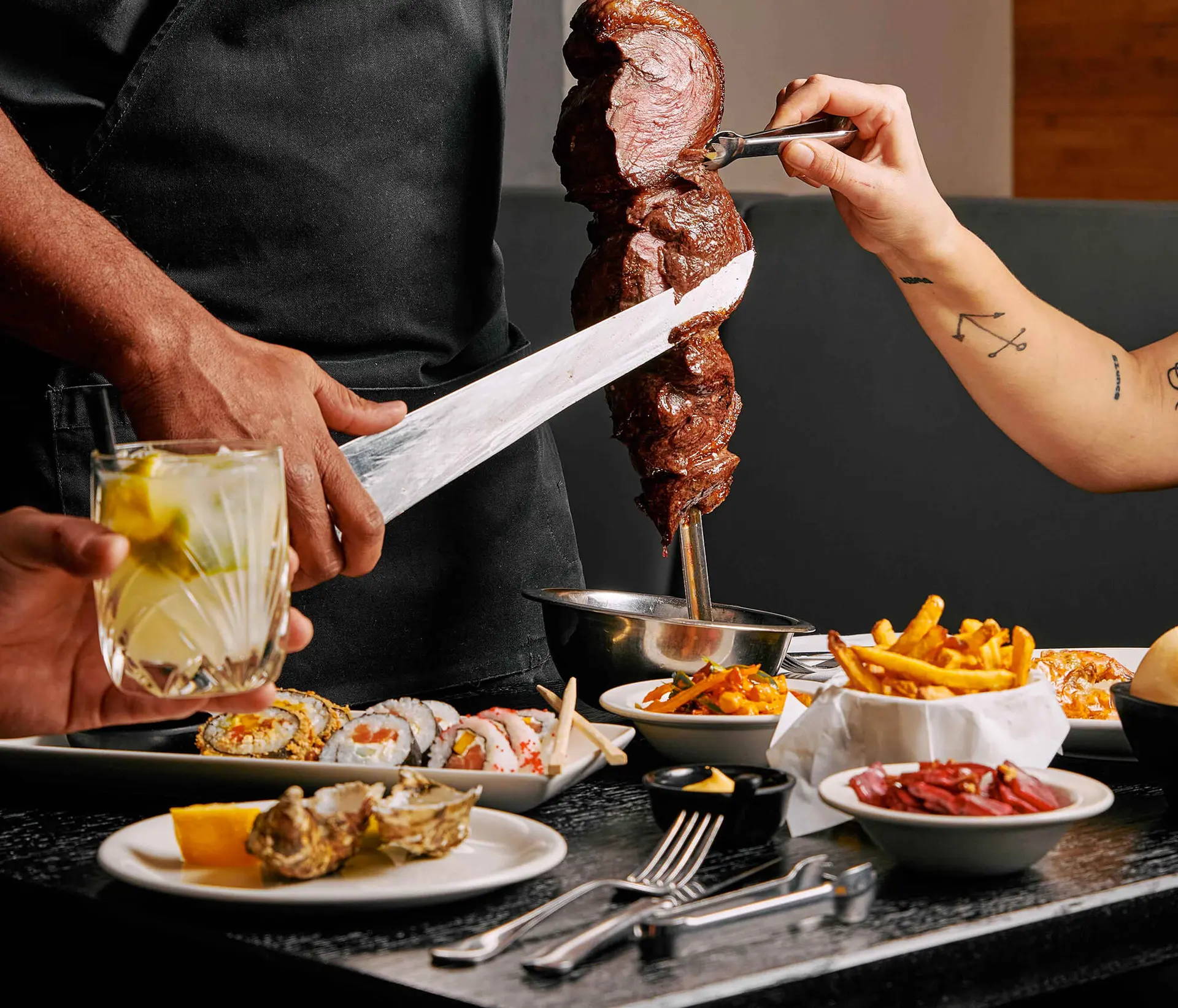 Tableside carving of grilled beef skewer at Brasileiro restaurant.
